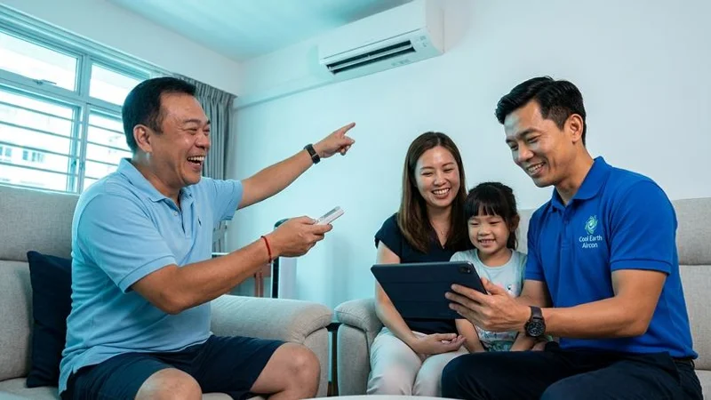Happy Singapore family enjoying cool comfortable home with efficient aircon while keeping electricity costs low and manageable